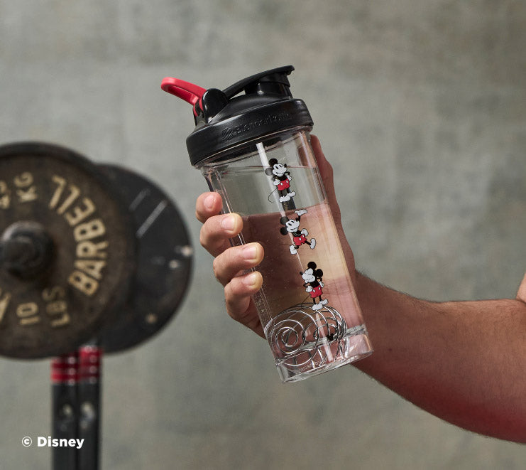 pro-series-w3-2 Mickey_Mouse_Protein_Shaker_Bottle_Being_Held_In_the_Gym.jpg